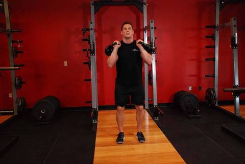 Double Kettlebell Jerk — bitiş pozisyonu