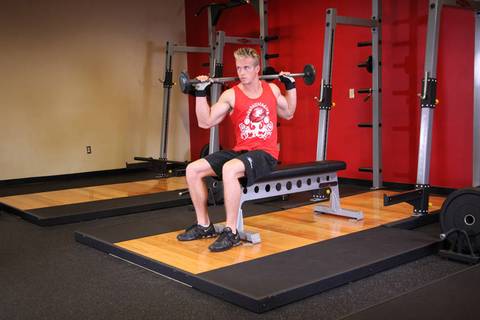 Seated Barbell Twist — bitiş pozisyonu