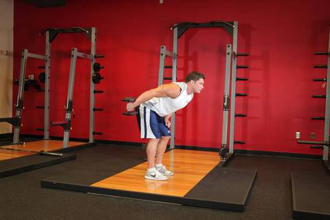 Standing Bent-Over One-Arm Dumbbell Triceps Extension — bitiş pozisyonu